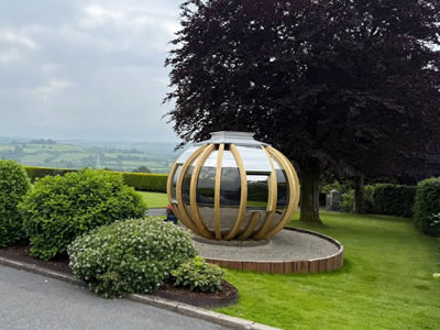 After circular garden pod base with sleepers and concrete pad in Llandeilo